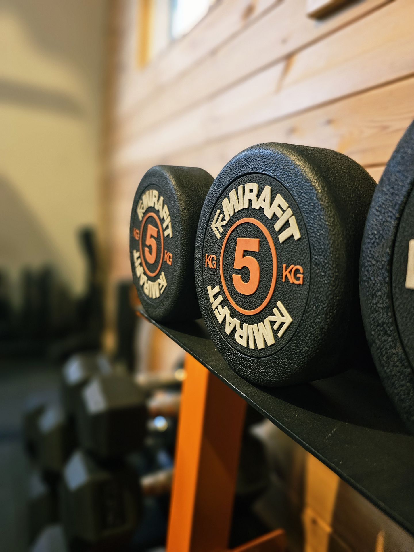 Mirafit dumbbells on the studio rack