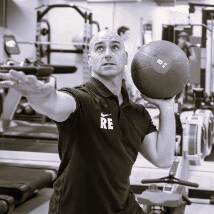 Richard Edrich coaching with a medicine ball