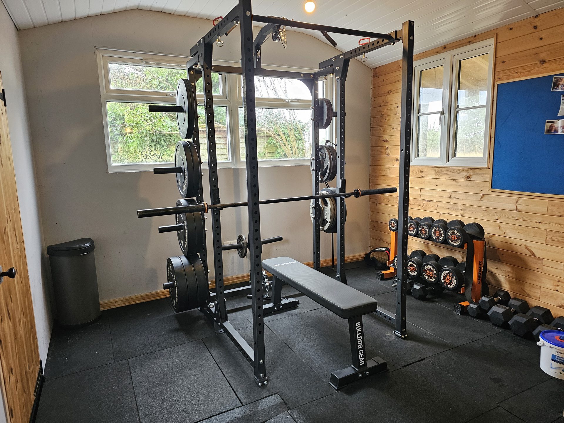Squat rack, bench and dumbbells in the studio